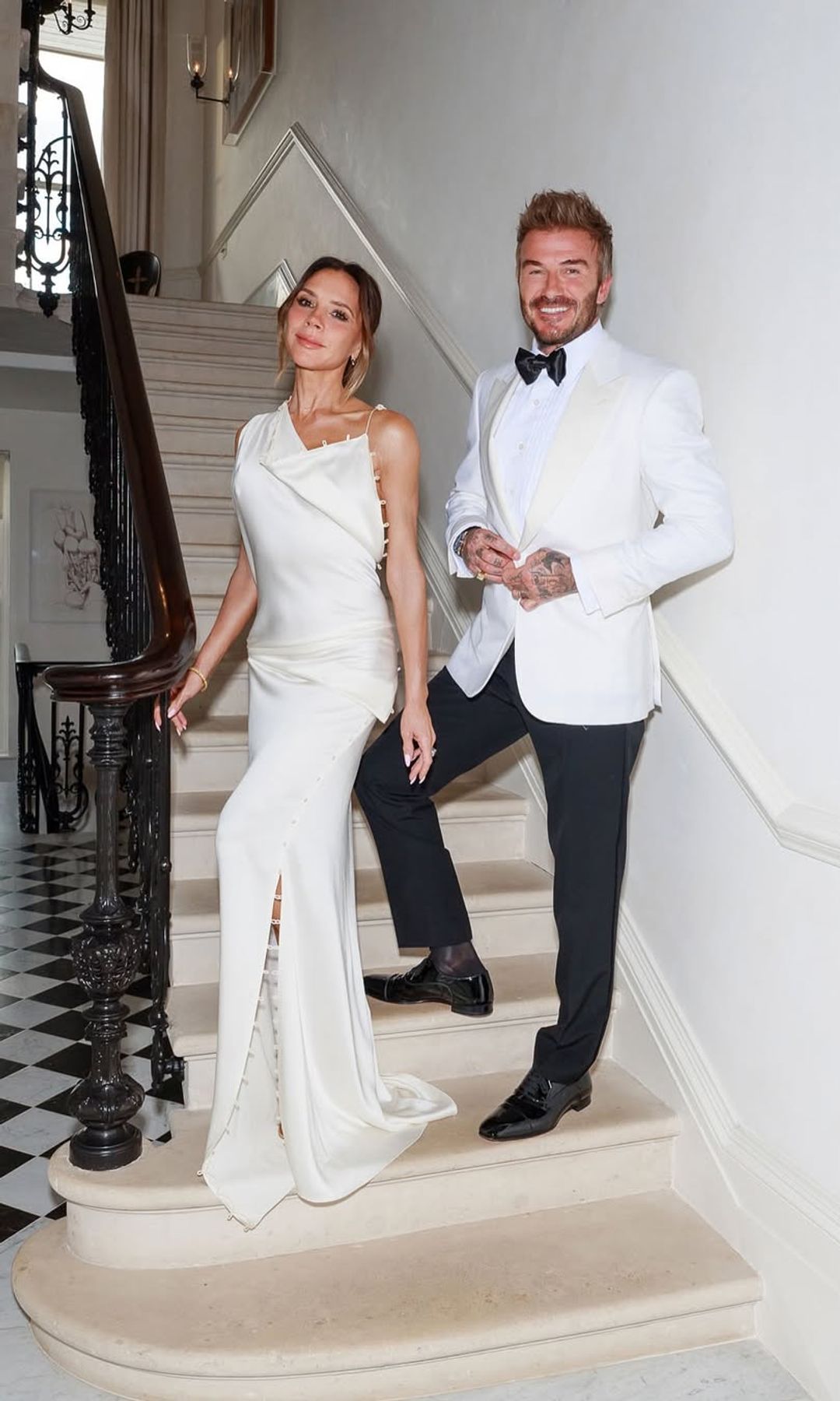 Victoria and David Beckham on the stairs