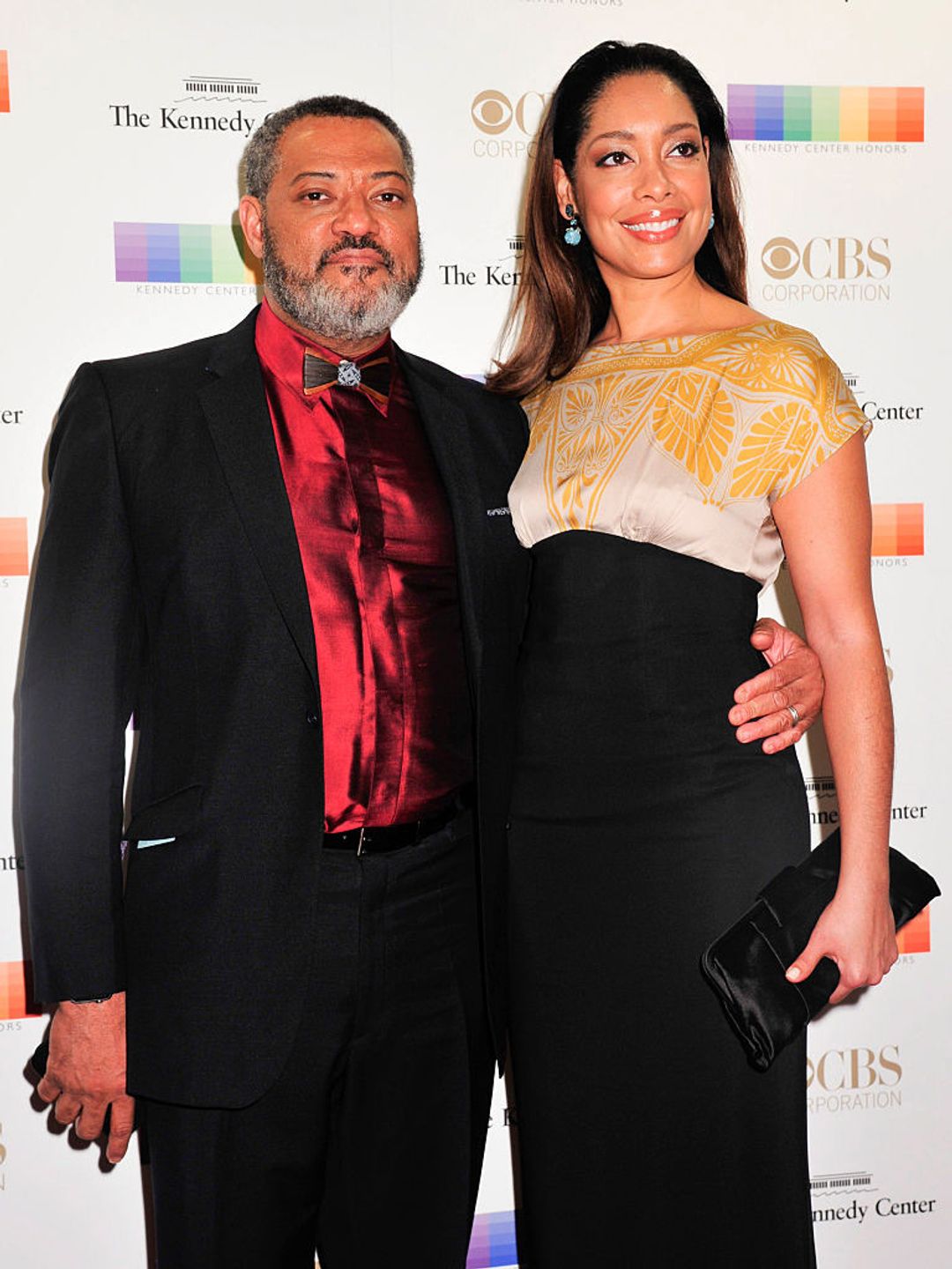 Gina Torres and Laurence Fishburne on the red carpet. 