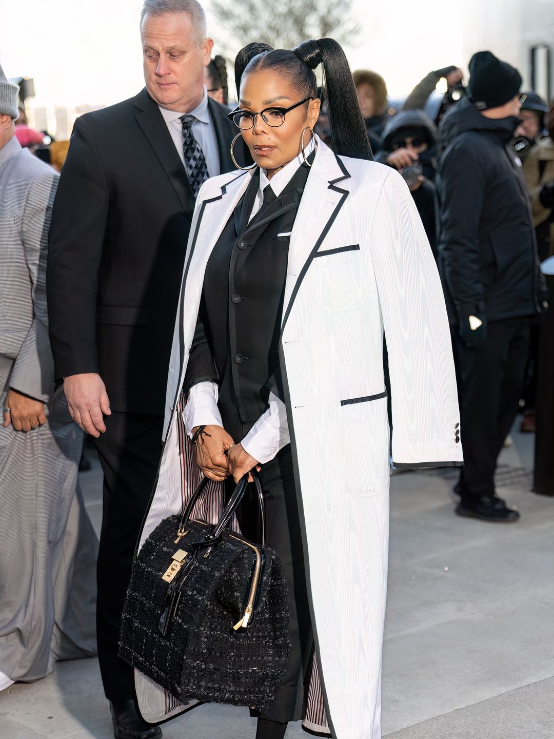 Janet Jackson attended the Thom Browne show in a full Thom Browne look complete with pigtails and oversized hoop earrings. 