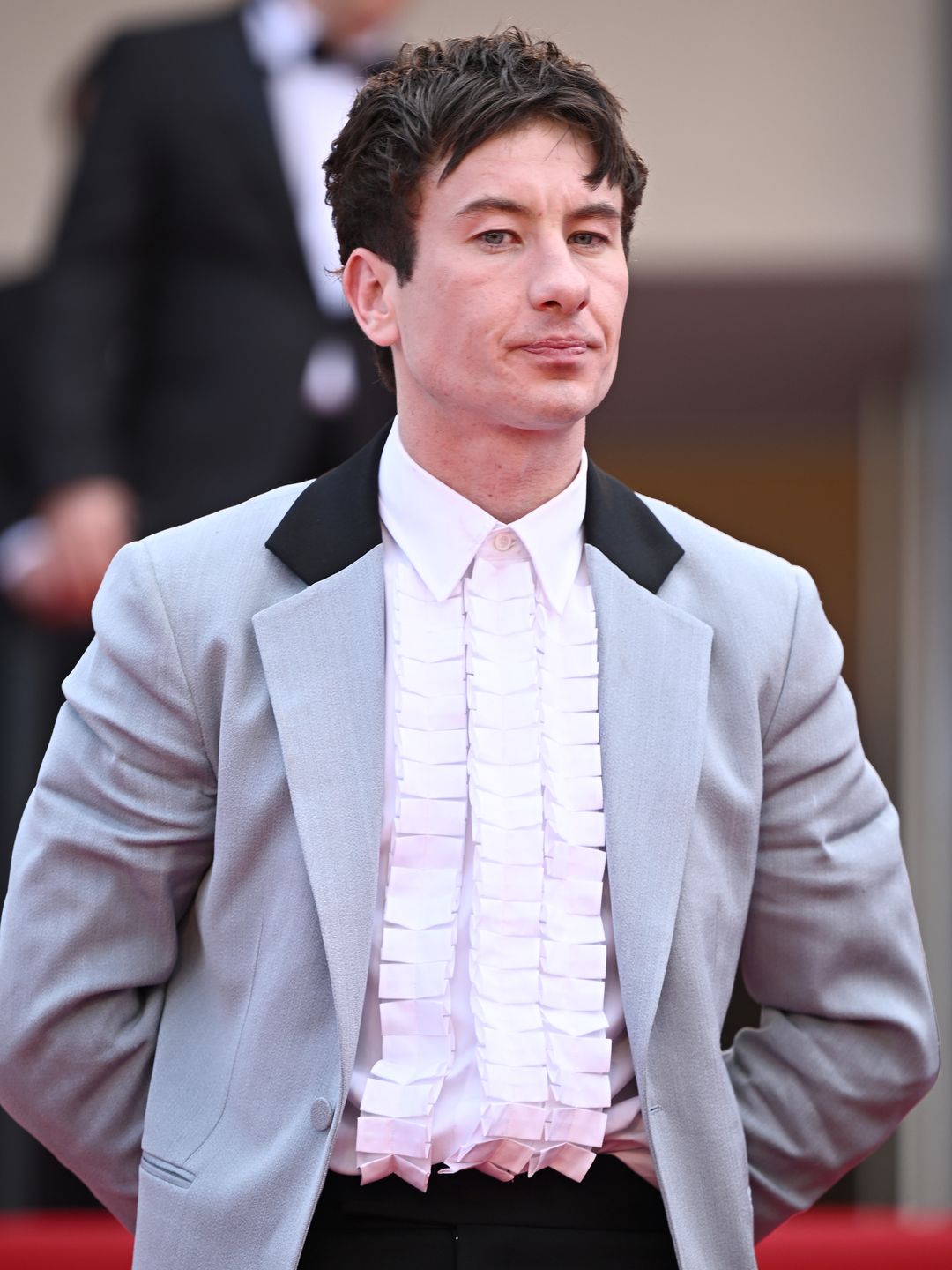 Barry Keoghan in a grey jacket and white shirt