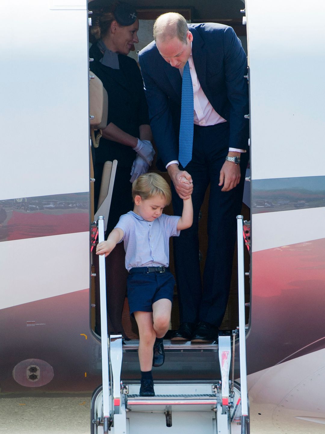 Prince William and Prince George getting off a plane
