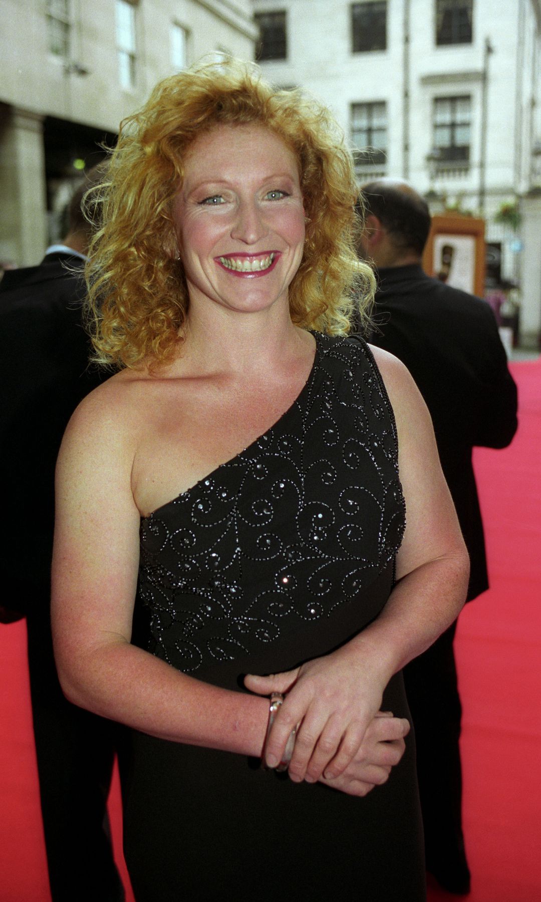 Charlie Dimmock in a black dress on a red carpet