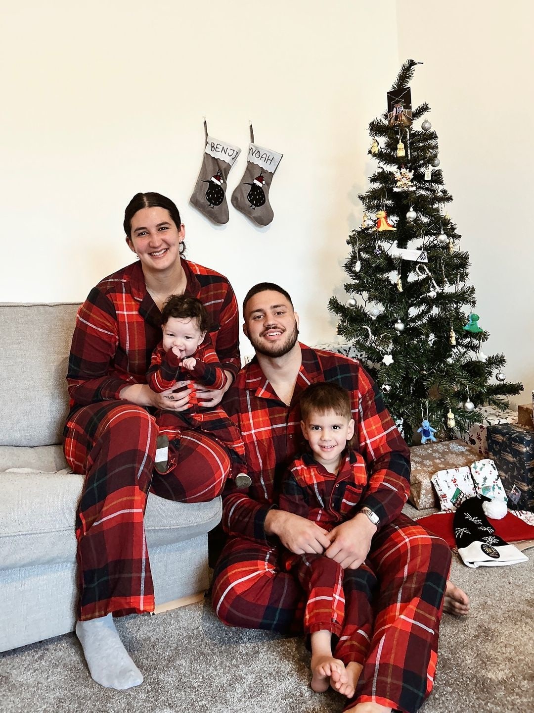 family in matching christmas pyjamas 