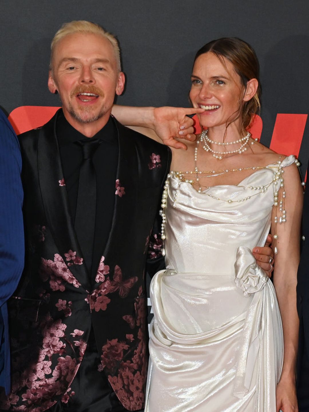 Simon Pegg and Rebecca Ferguson share a laugh on the red carpet 