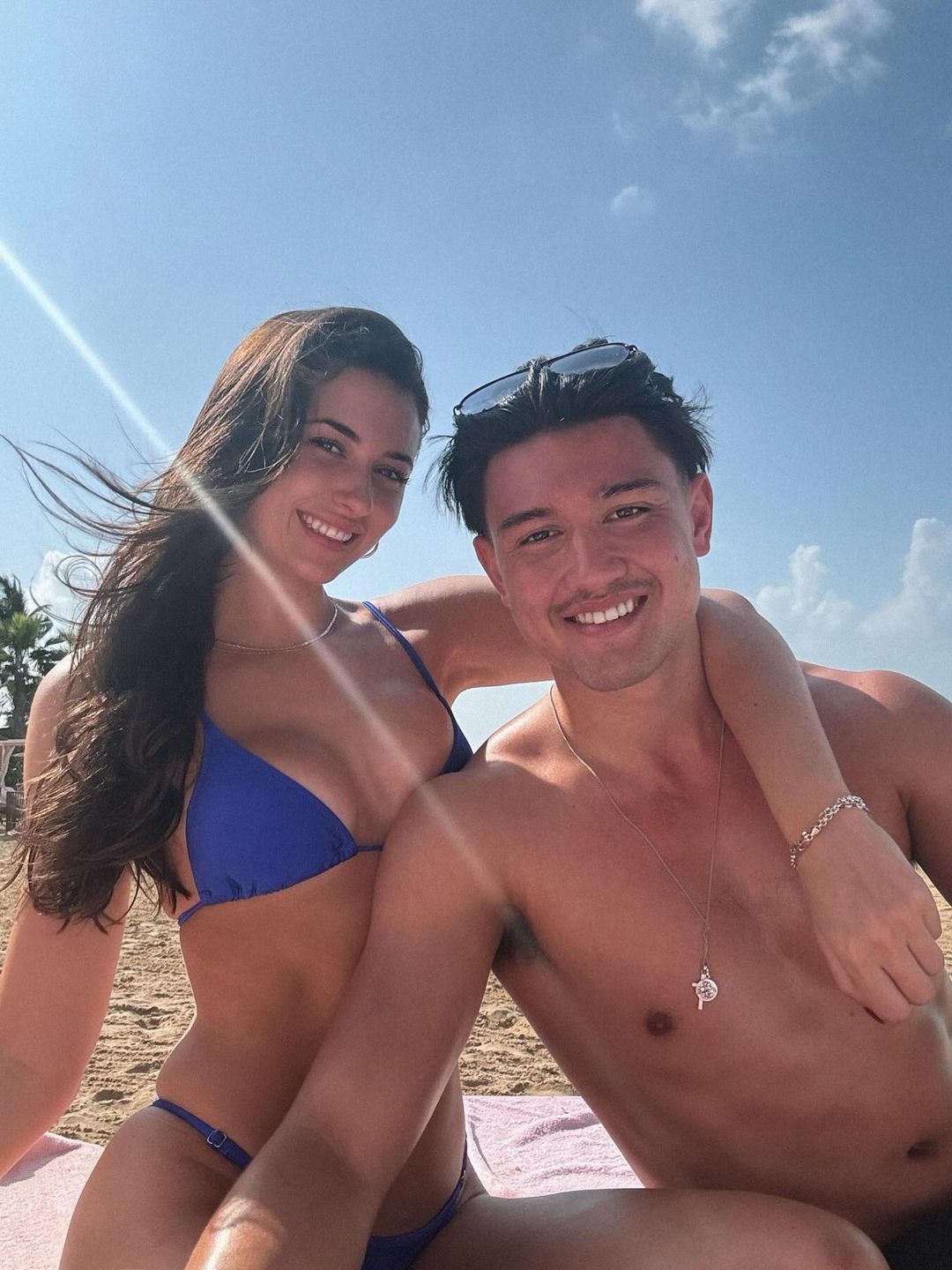 couple posing at the beach 