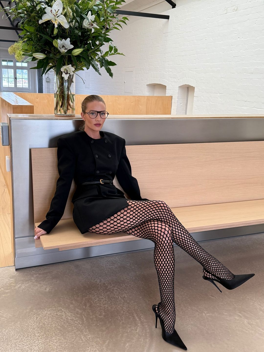 Rosie Huntington-Whiteley just schooled us in styling fishnet tights with a mini-dress