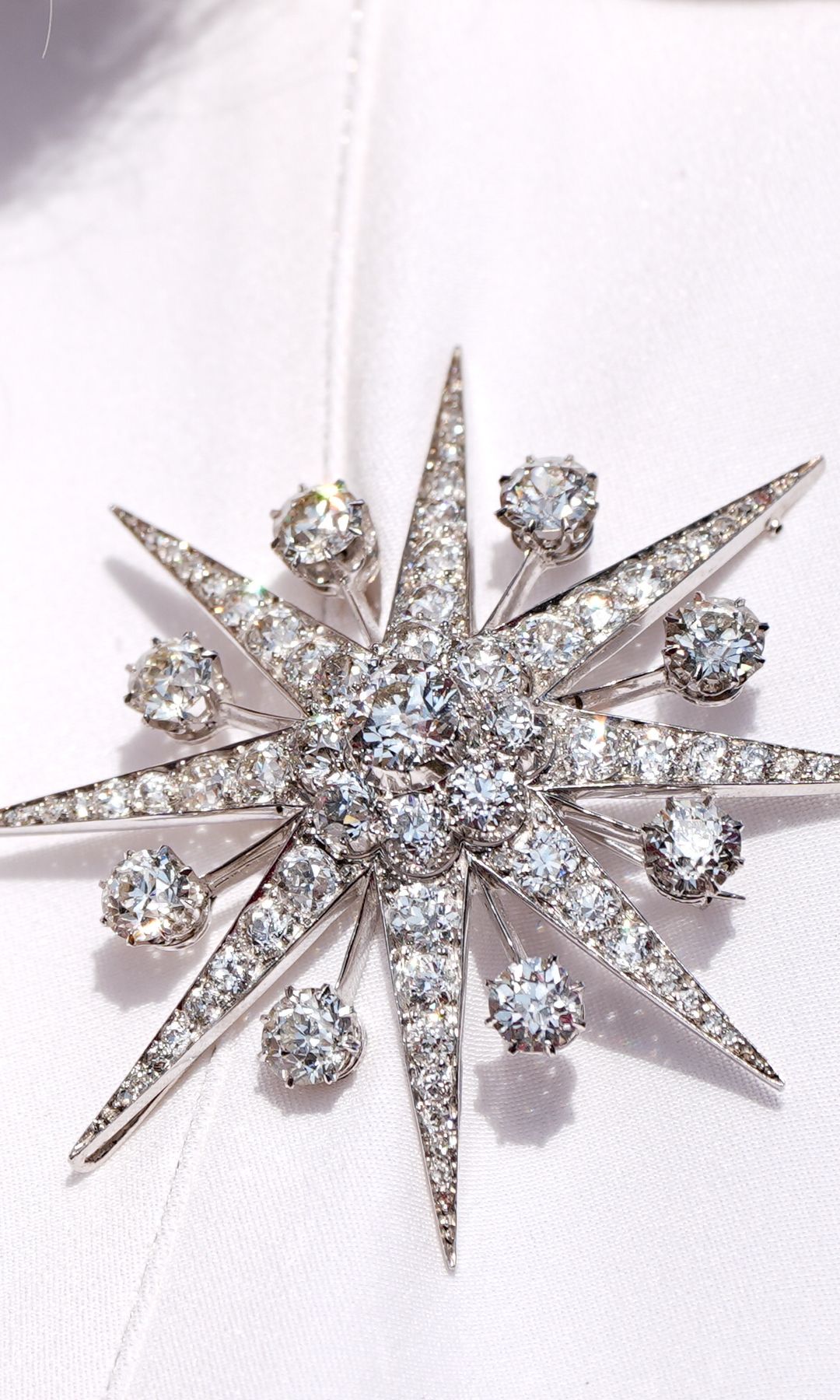 A diamond brooch on Queen Camilla's coat