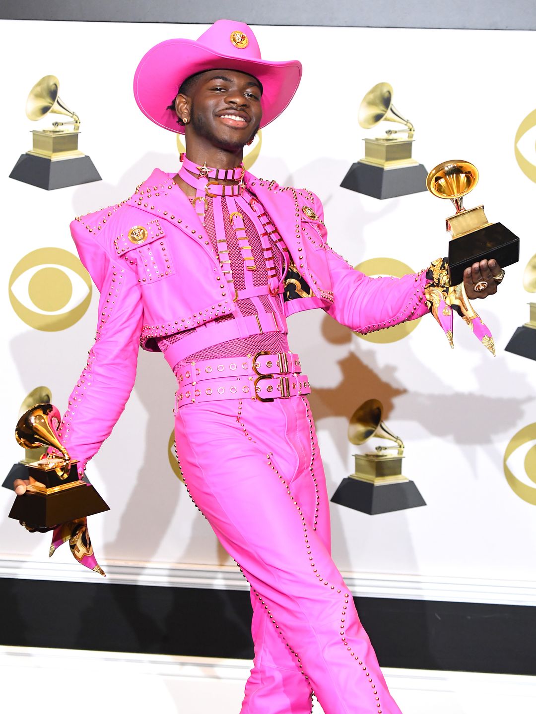  Lil Nas X poses at the 62nd Annual GRAMMY Awards in a Versace Pink suit