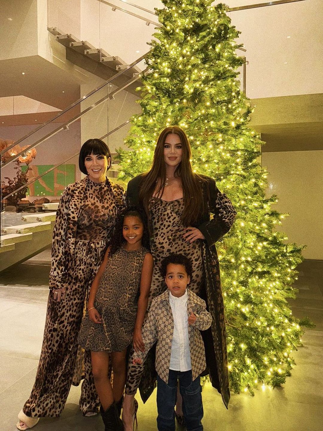 Khloé Kardashian and her children True and Tatum, plus Kris Jenner, pose in front of the former's Christmas tree during their Thanksgiving dinner, shared on Instagram