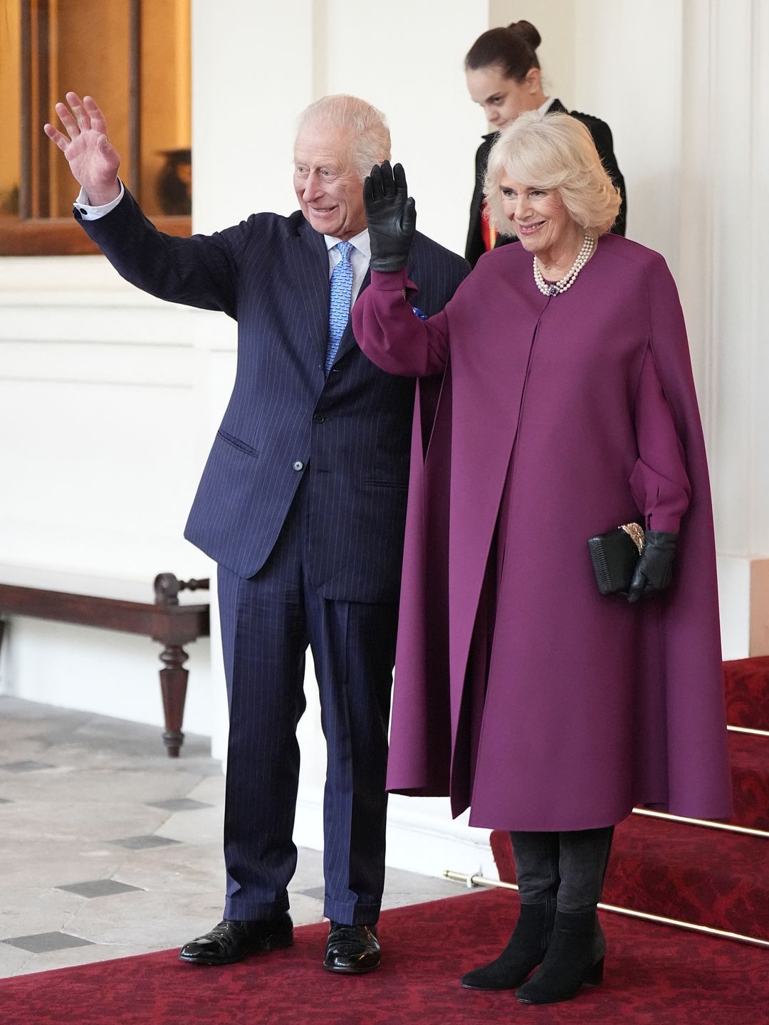 Britain's King Charles III and Britain's Queen Camilla wave as they formally bid farewell to Qatar's Emir Sheikh Tamim bin Hamad al-Thani and his wife Sheikha Jawaher bint Hamad bin Suhaim al-Thani at Buckingham Palace in central London, on December 4, 2024, on the second day of the Emir's two-day State Visit to Britain. The Emir of Qatar and his wife are in the UK for a two-day State Visit, hosted by Britain's King.