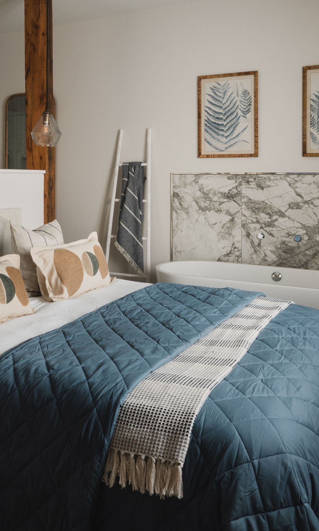 Bedroom with a standalone bath tub in the corner