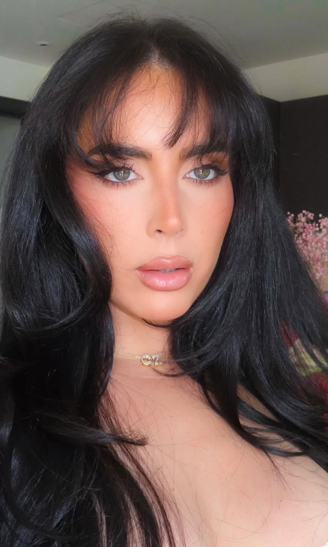 cinzia with jet black hair and curtain bangs 