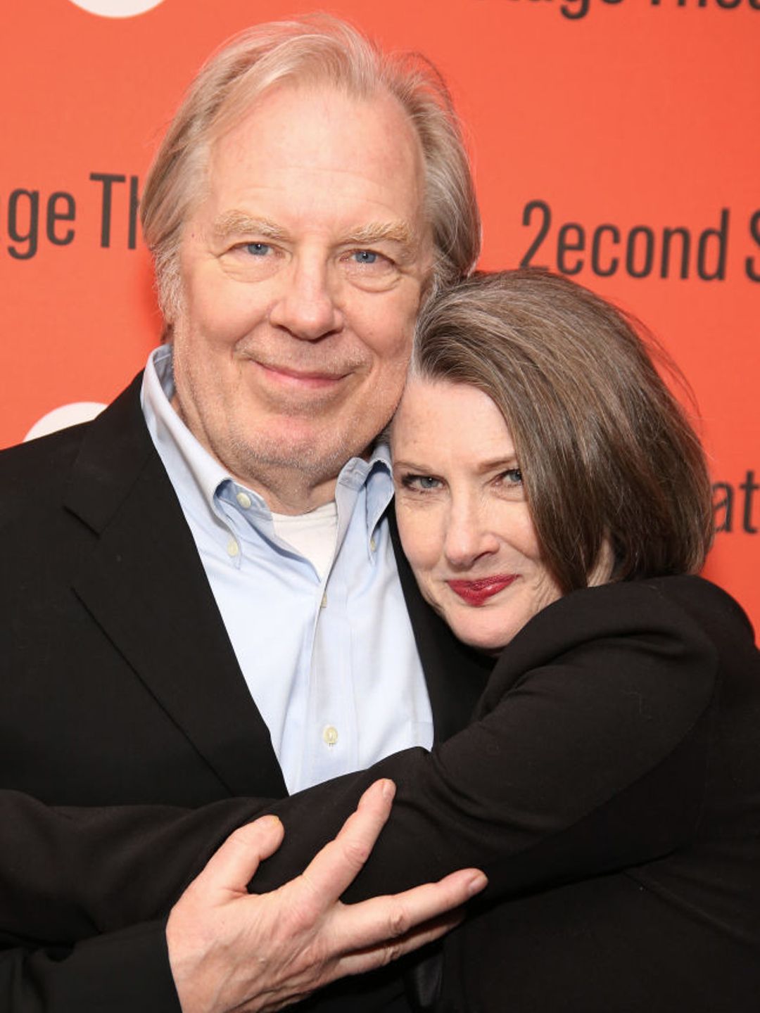 Michael McKean and Annette O'Toole cuddle for a photo
