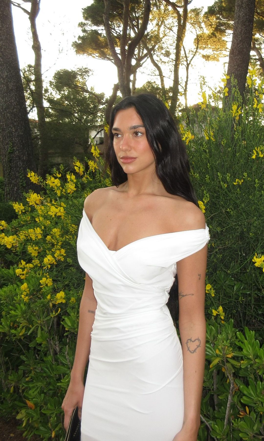 Dua Lipa poses in a white gown on her Instagram