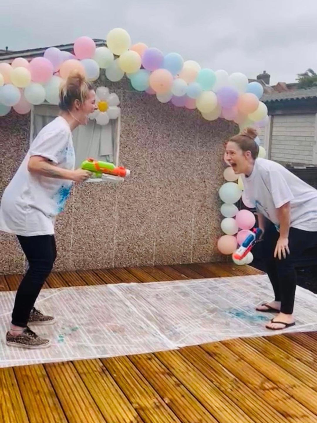 The couple had a fun gender reveal with water pistols