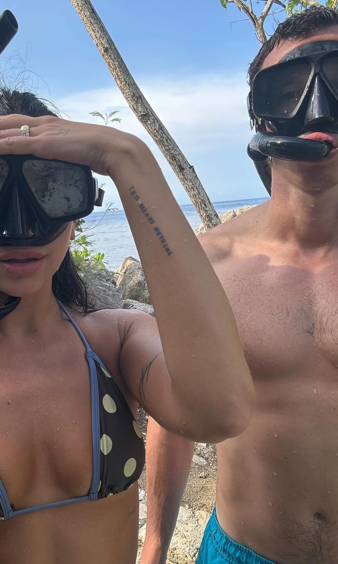 Dua Lipa and Callum Turner pose for a pic in snorkles 