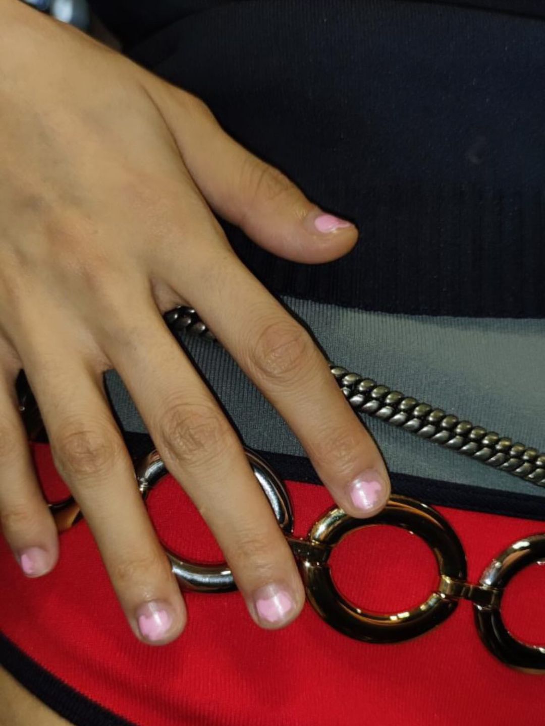 A close up of a models hand at the Miu Miu SS25 show