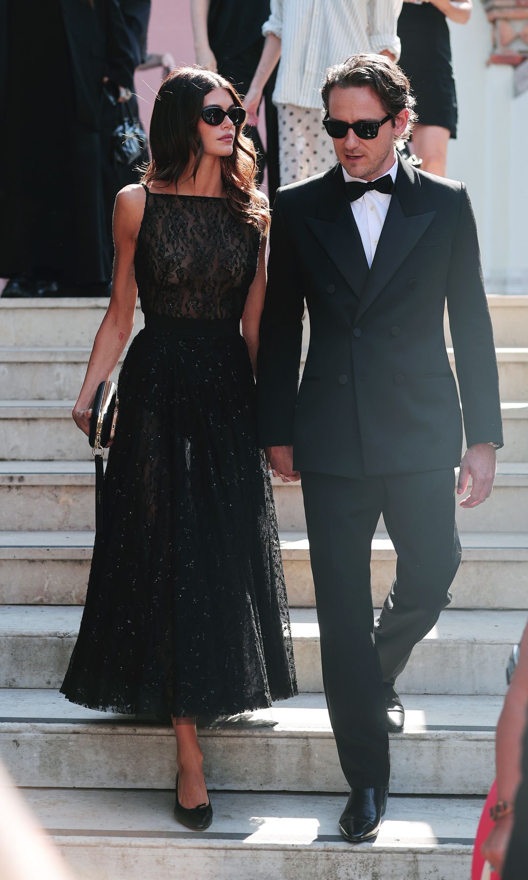 Kaia Gerber and Lewis Pullman depart from Hotel Excelsior during the 82nd Venice International Film Festival on September 01, 2025 in Venice, Italy