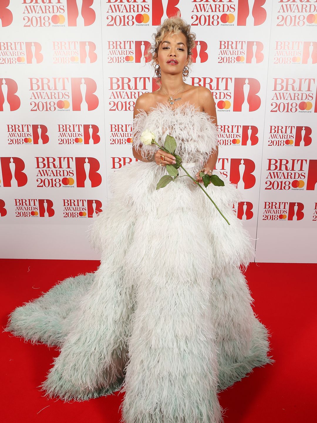 Rita Ora attends The BRIT Awards 2018 Red Carpet in a feather gown