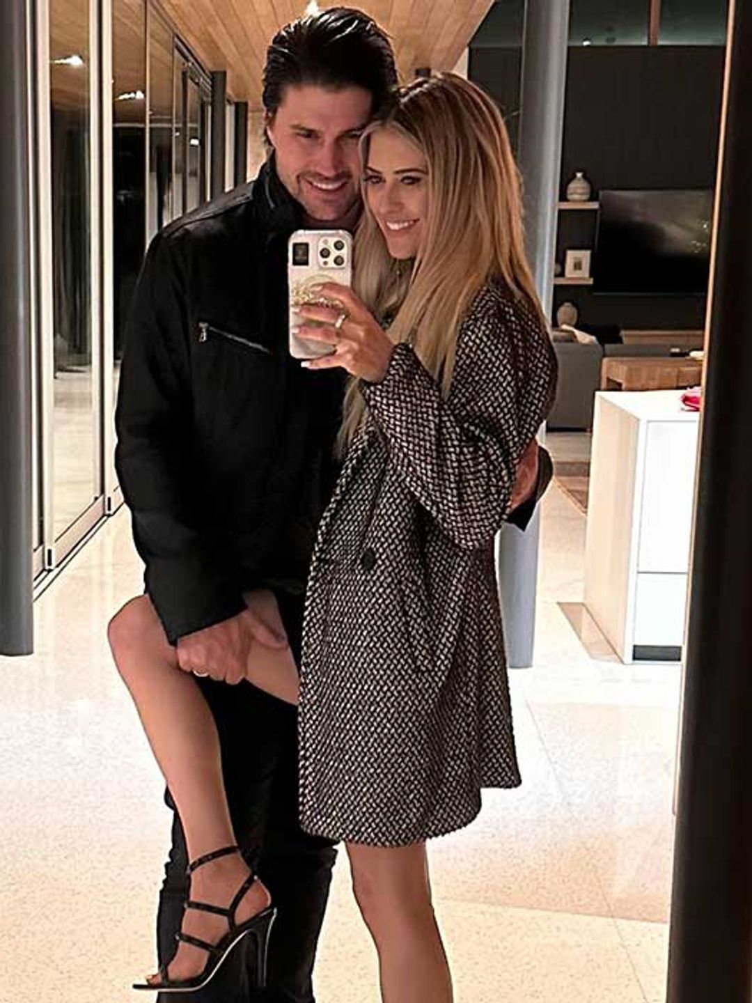 Christina and her husband Josh Hall posing for a mirror selfie