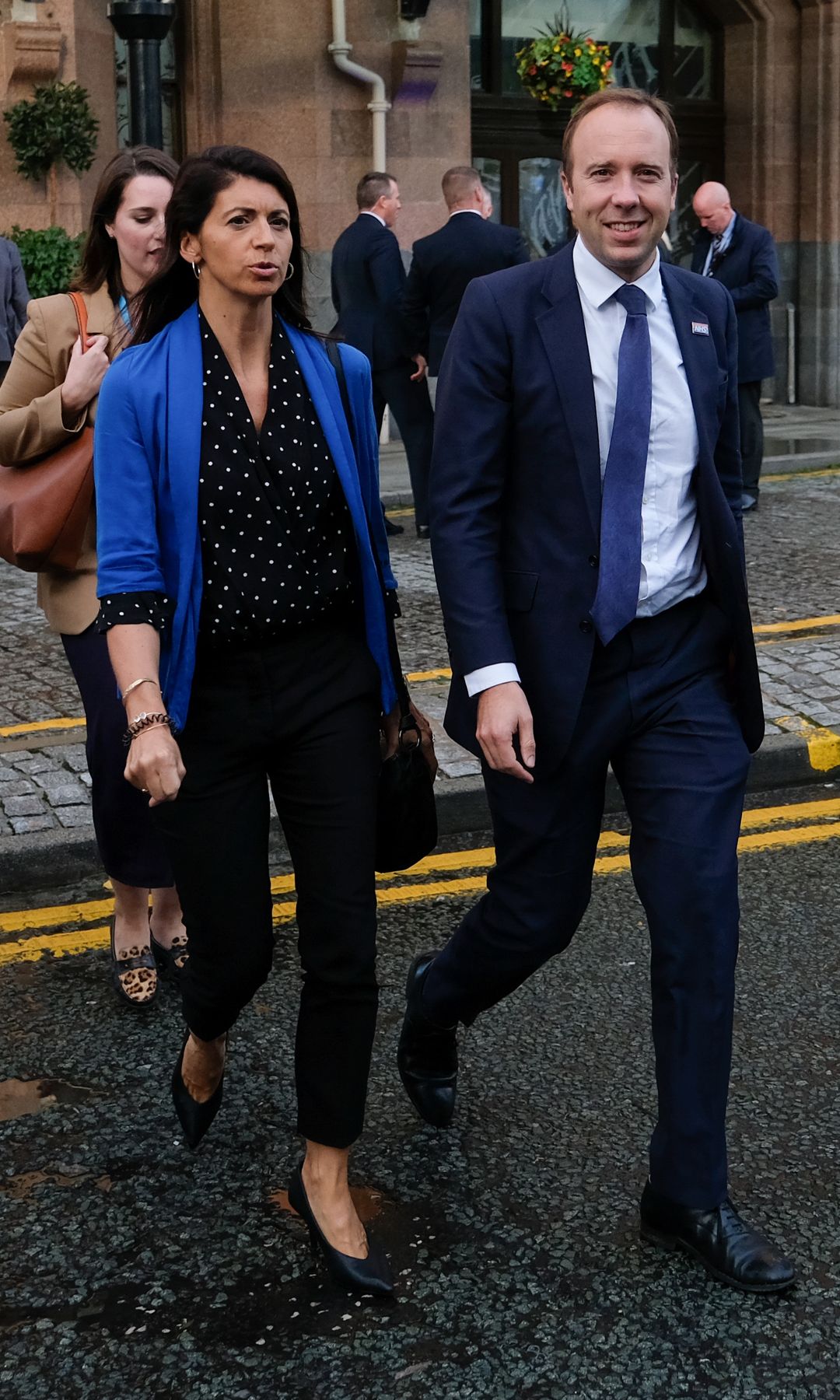 Gina Coladangelo walking with Matt Hancock