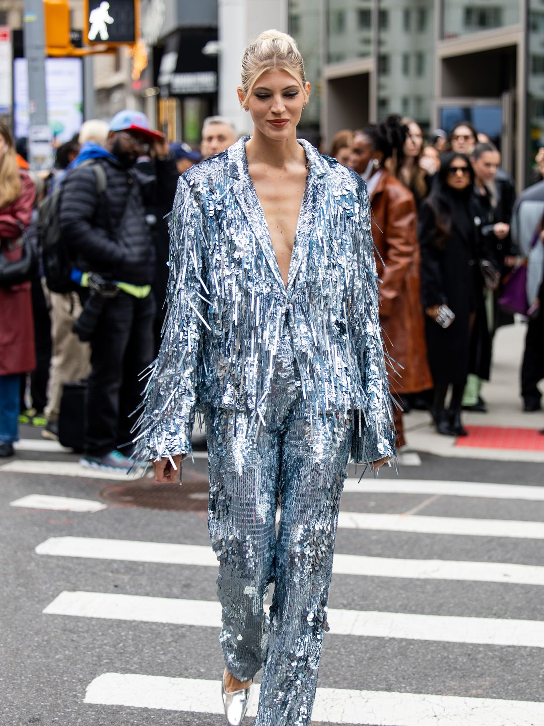 Devon Windsor wears silver shiny fringes jacket, pants outside Lapointe in nYC