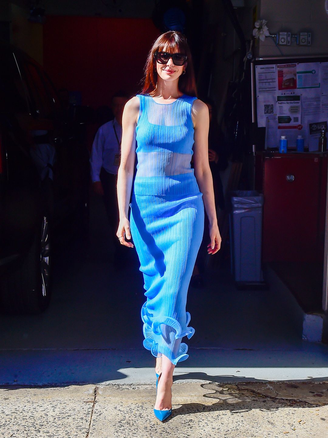 Anne Hathaway is seen on April 29, 2024 in New York City wearing a blue twin set suit 