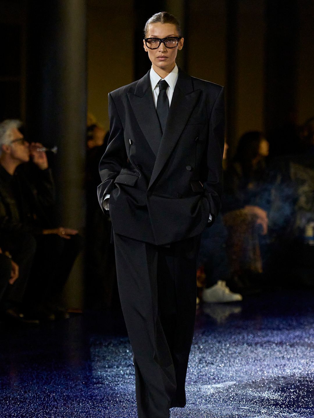 Bella Hadid wears a suit on the Saint Laurent SS25 Runway