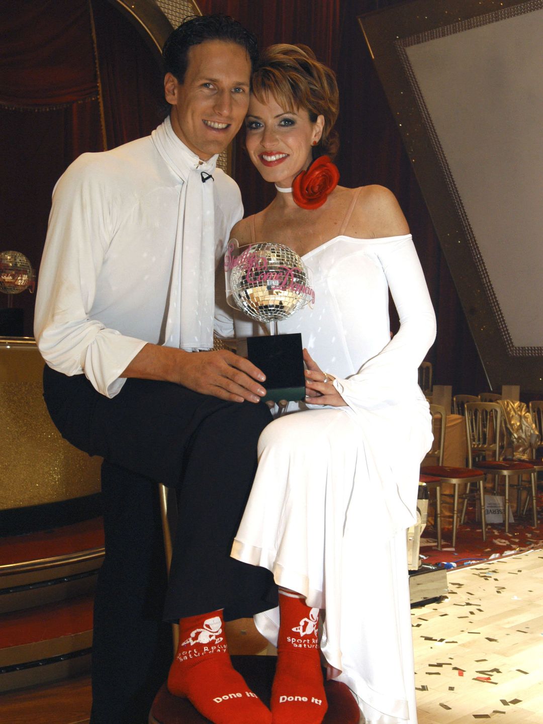 Brendan Cole and Natasha Kaplinsky holding the Glitterball Trophy