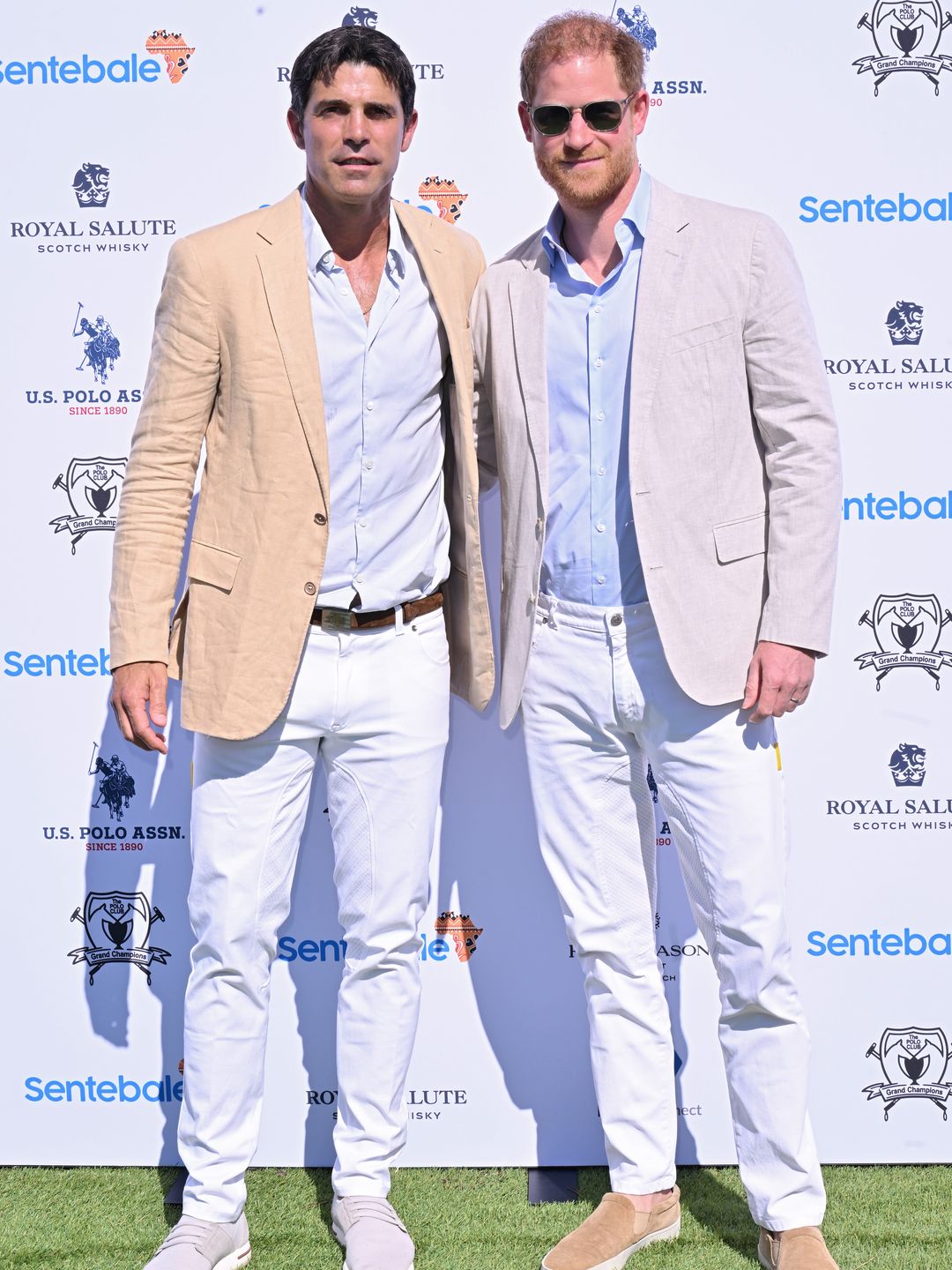 Nacho Figueras standing with Prince Harry