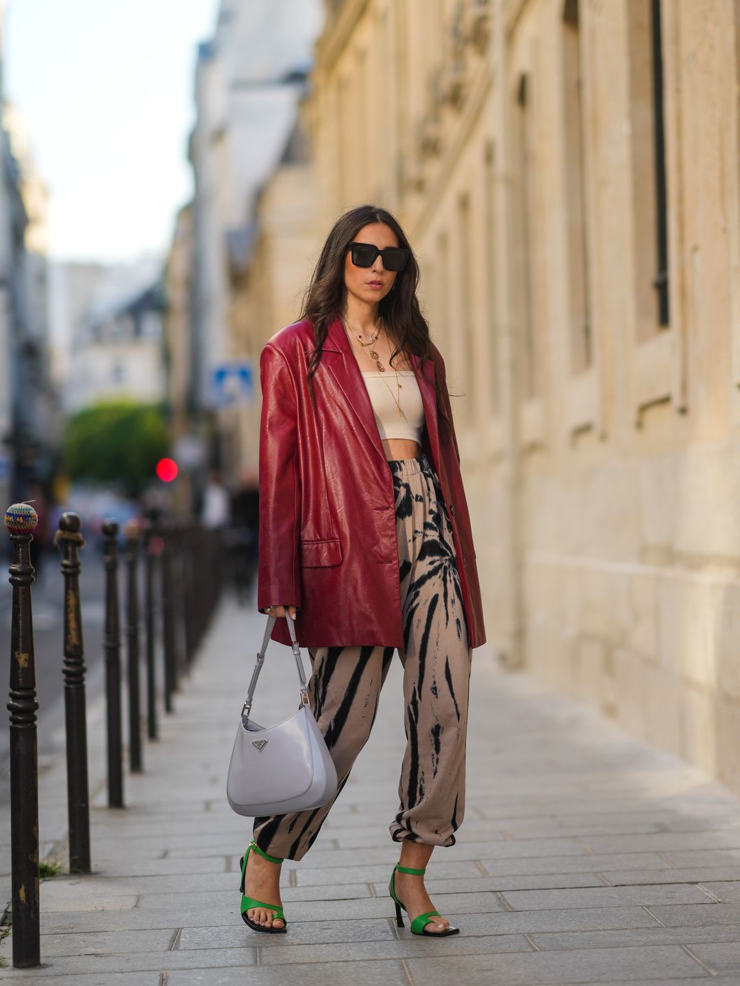 Gabriella Berdugo pairs and oversized leather blazer with sweatpants for a chic summer aesthetic