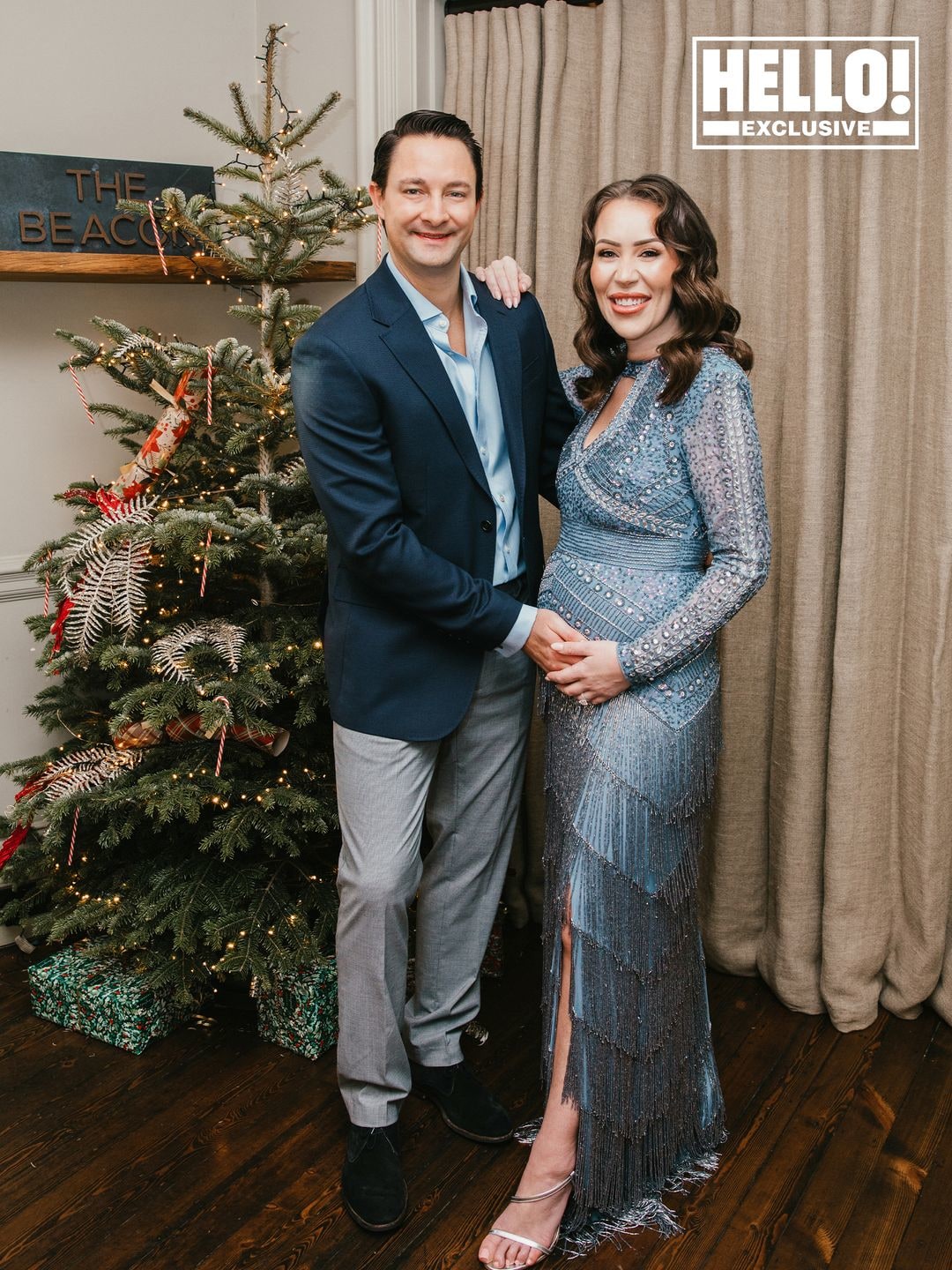 Ellie Phillips pregnancy reveal photoshoot with husband Robert Dee with Christmas tree