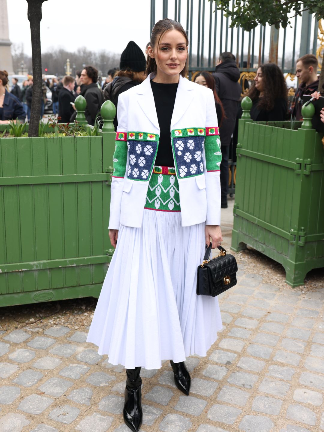 Olivia Palermo attends the Christian Dior Womenswear Fall/Winter 2024-2025 show in a white blazer and skirt combo