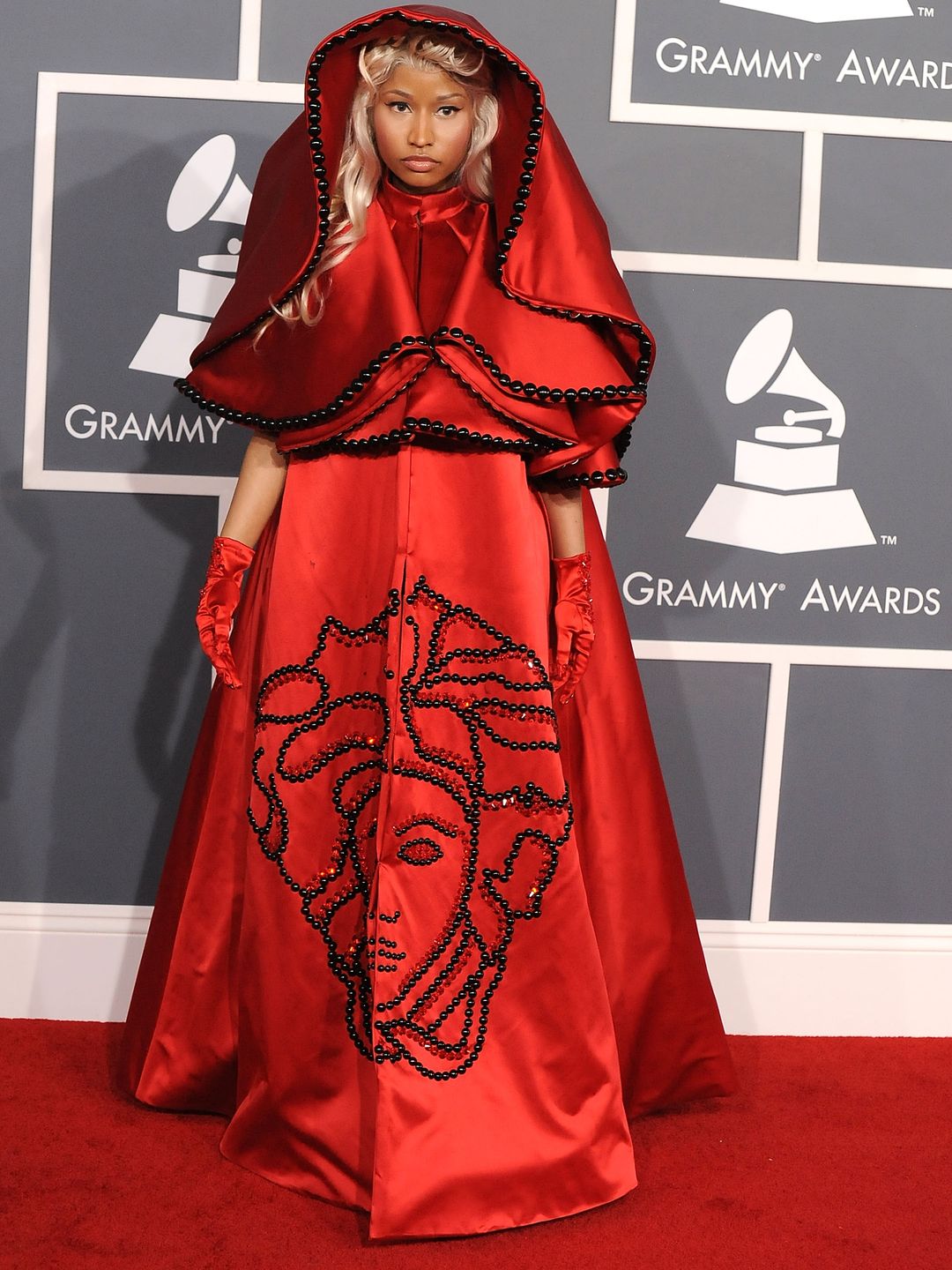 Nicki wore a red Versace cape dress emblazoned with the brand's signature Medusa head back in 2012.