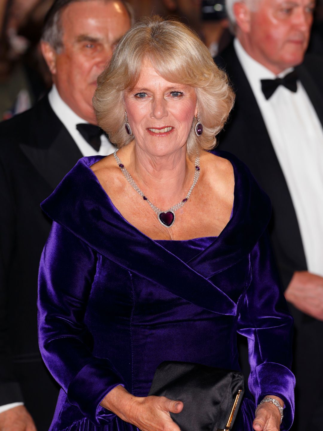 queen camilla in purple velvet dress 