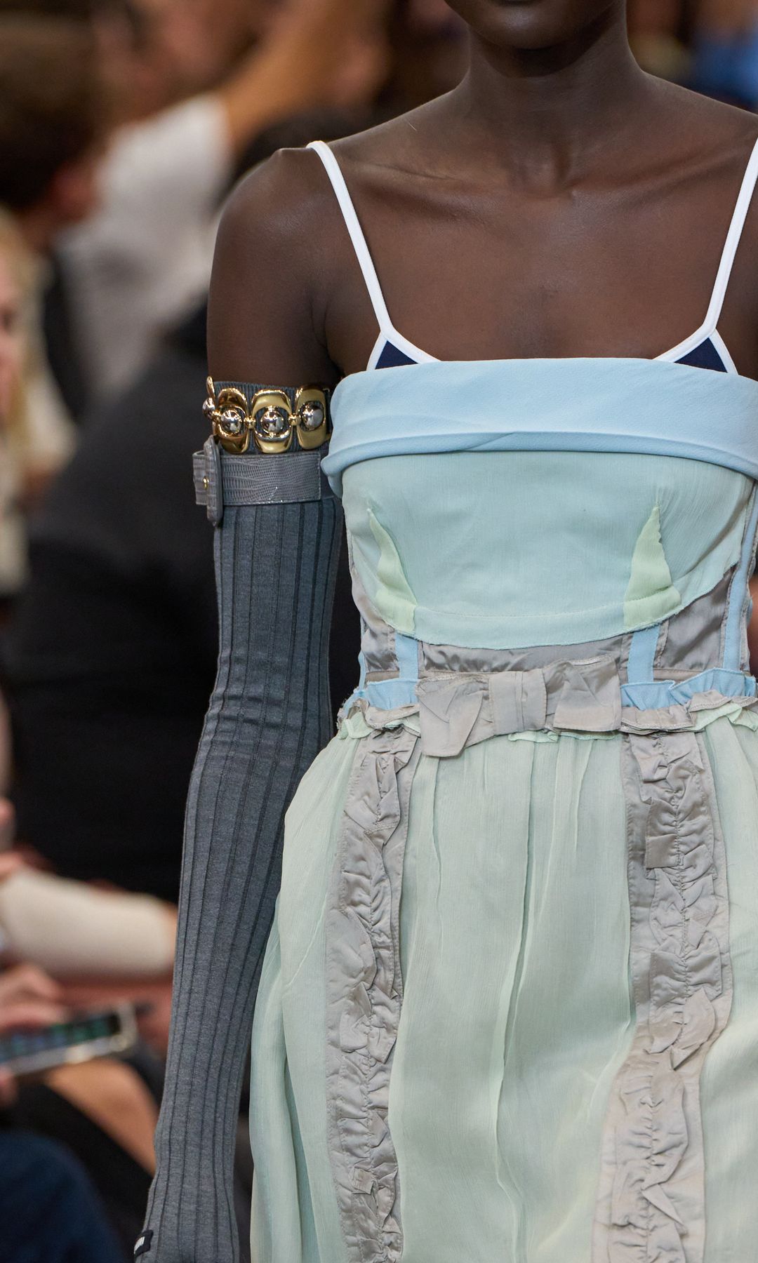 On the catwalk, models wore the cuff with long gloves