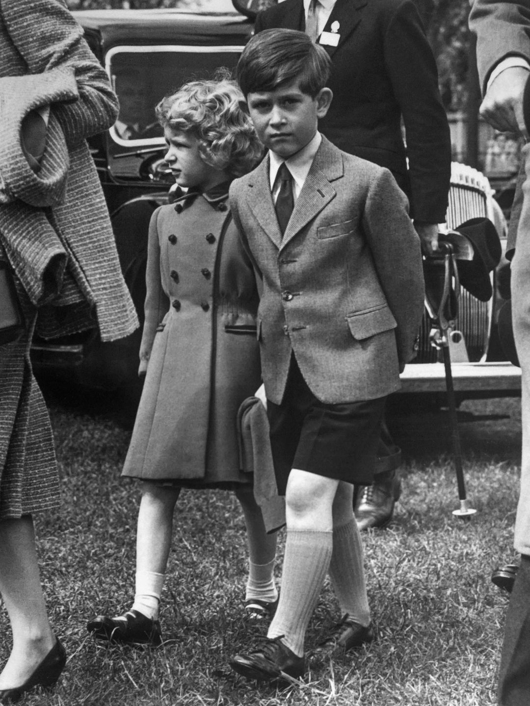 Then-Prince Charles and Princess Anne walking at the Windsor castle in 1958