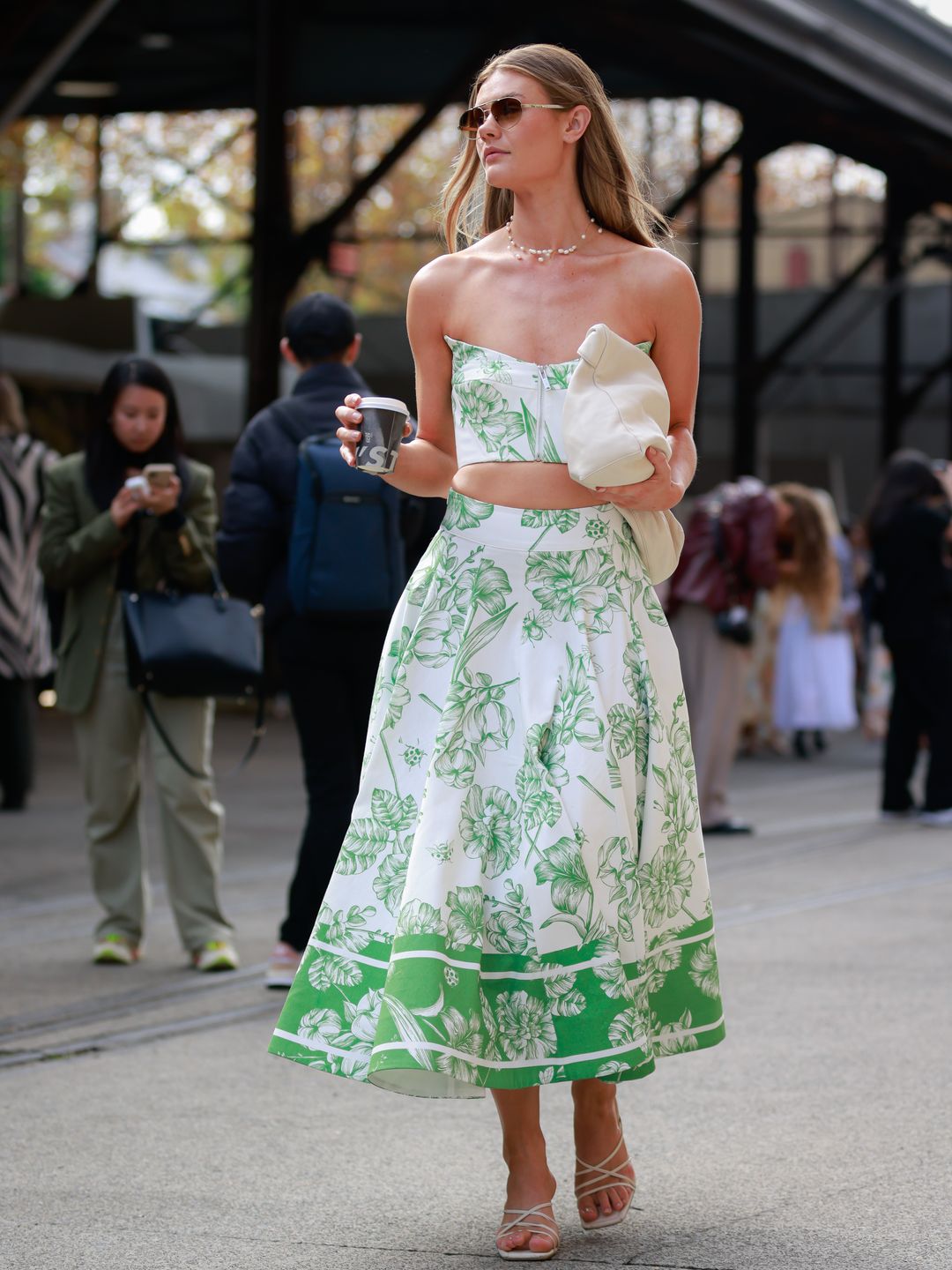 Jordan Simek wears a green and white bandeau top with a matching wide circle skirt 