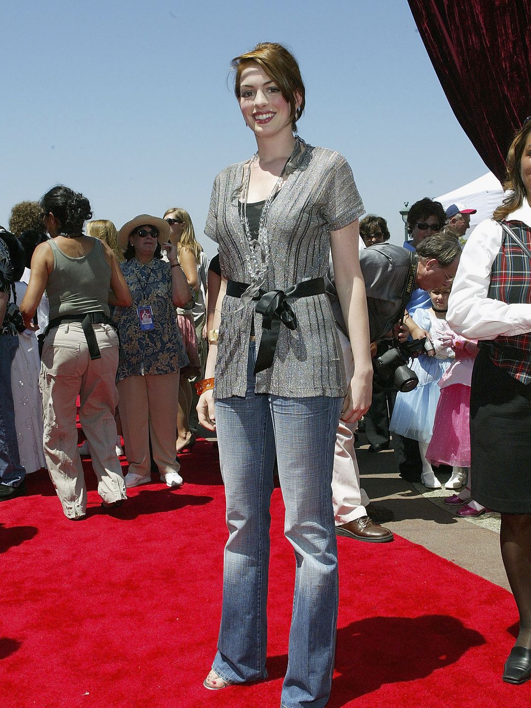 In a lurex cardigan we're sure we used to own, paired with jeans and a long necklace, at the 2004 premiere of the movie's sequel. 