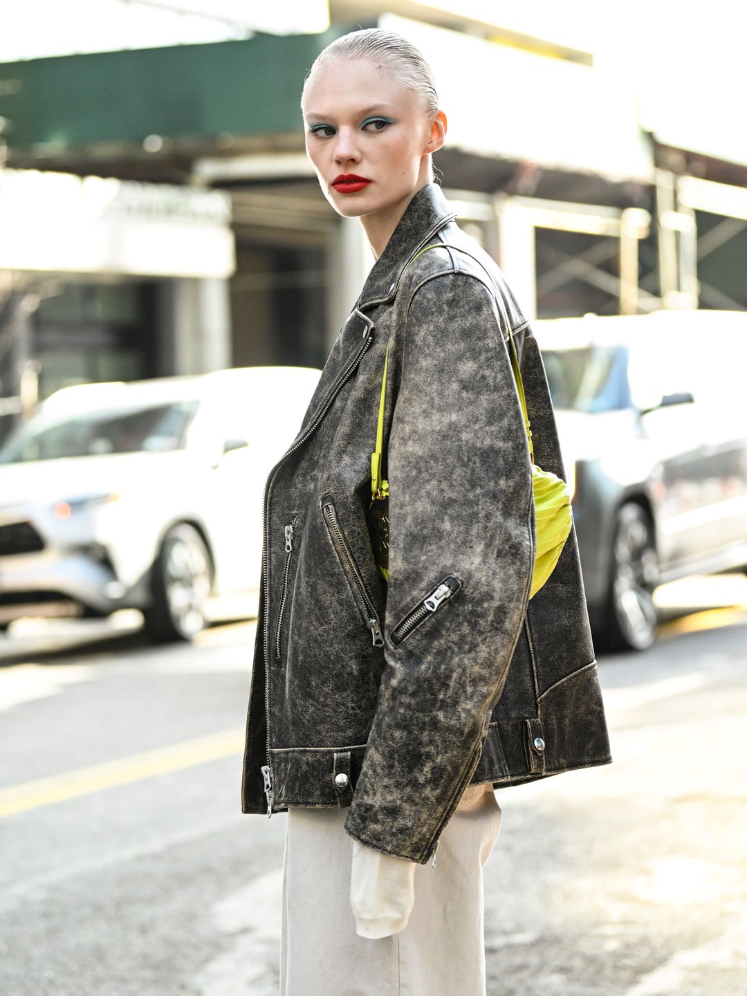 Model Vilma Sjoberg was seen wearing a Manokhi leather jacket with a lime green Loewe bag outside the Carolina Herrera show.