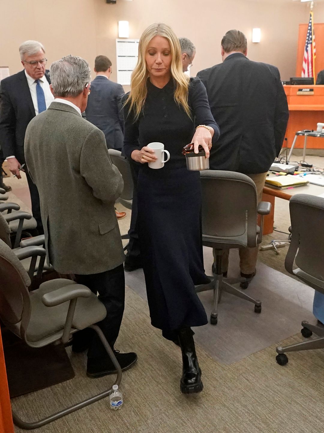 PARK CITY, UTAH - MARCH 24: Gwyneth Paltrow carries two beverages as she walks past the man suing her after testifying in court on March 24, 2023, in Park City, Utah. Terry Sanderson is suing actress Gwyneth Paltrow for $300,000, claiming she recklessly c