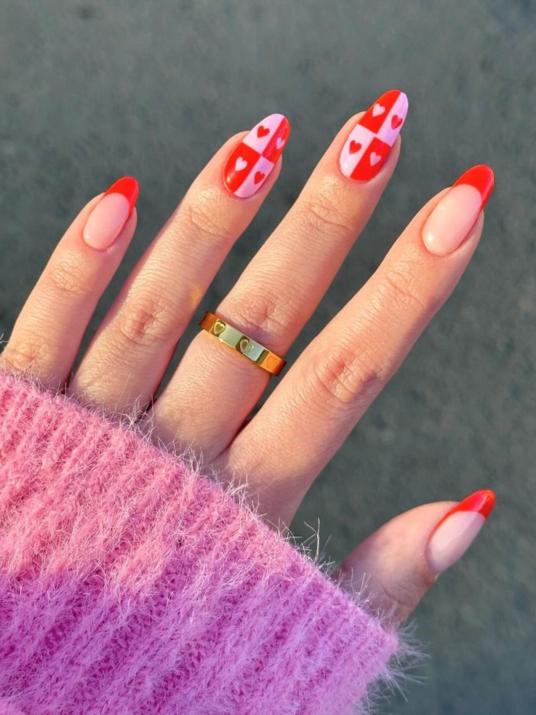 Nails with red and pink hearts and red tips 