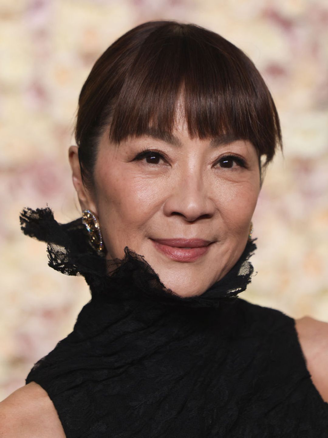 Michelle Yeoh's choppy auburn bangs made a statement at the Golden Globe Awards. 