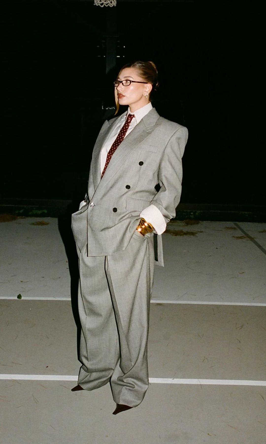 Hailey styled her Saint Laurent suit with heels and micro glasses