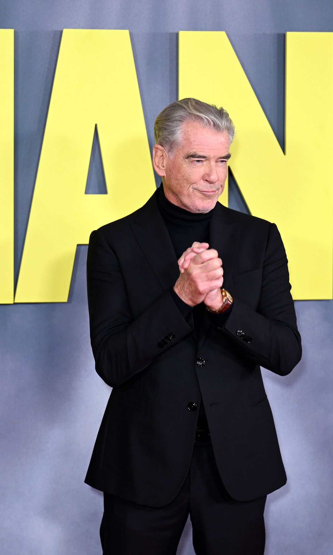 Pierce Brosnan in a black suit