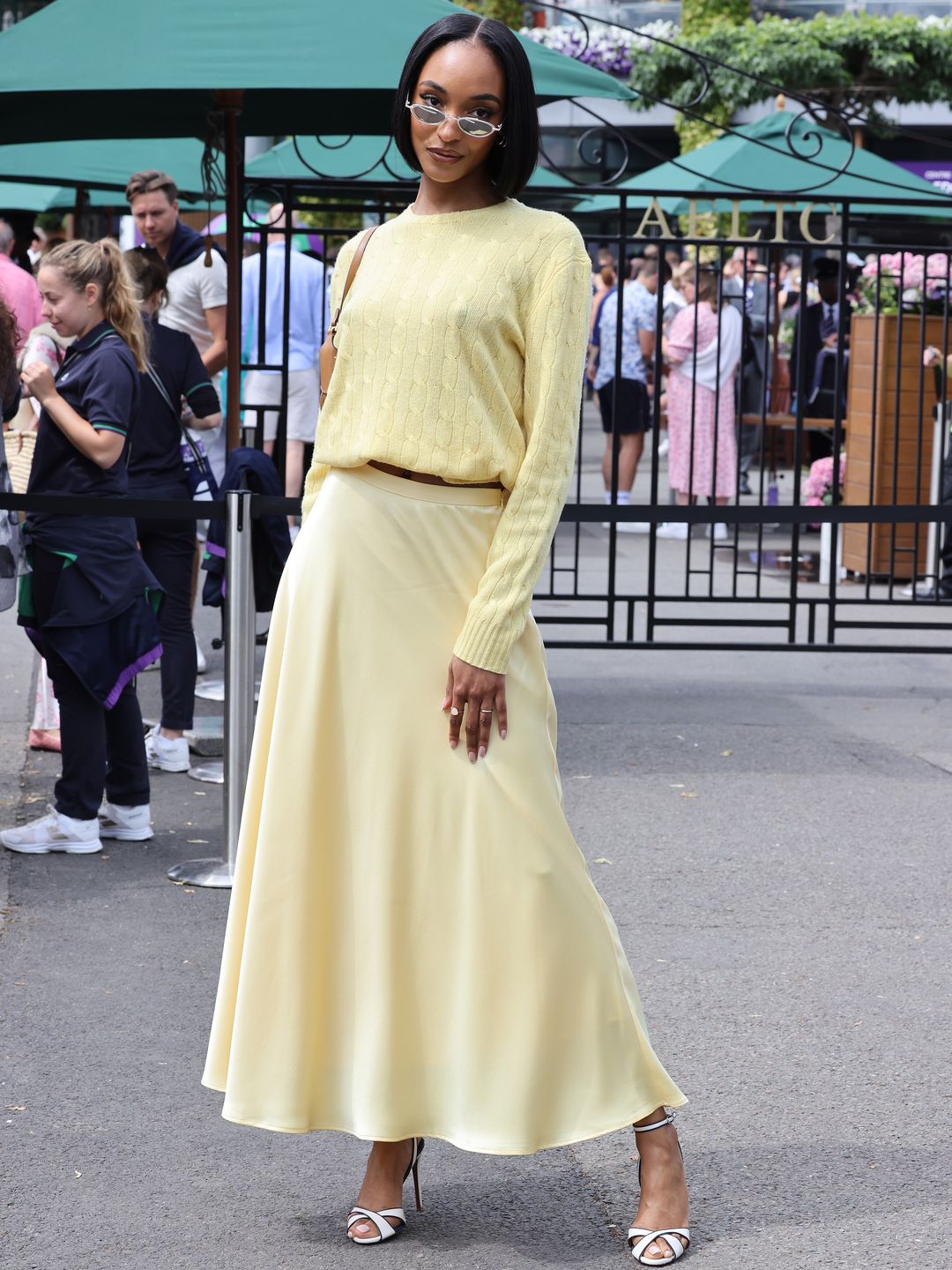 Jourdan Dunn wearing a pastel yellow cable knit with a relaxed-fit midaxi skirt 