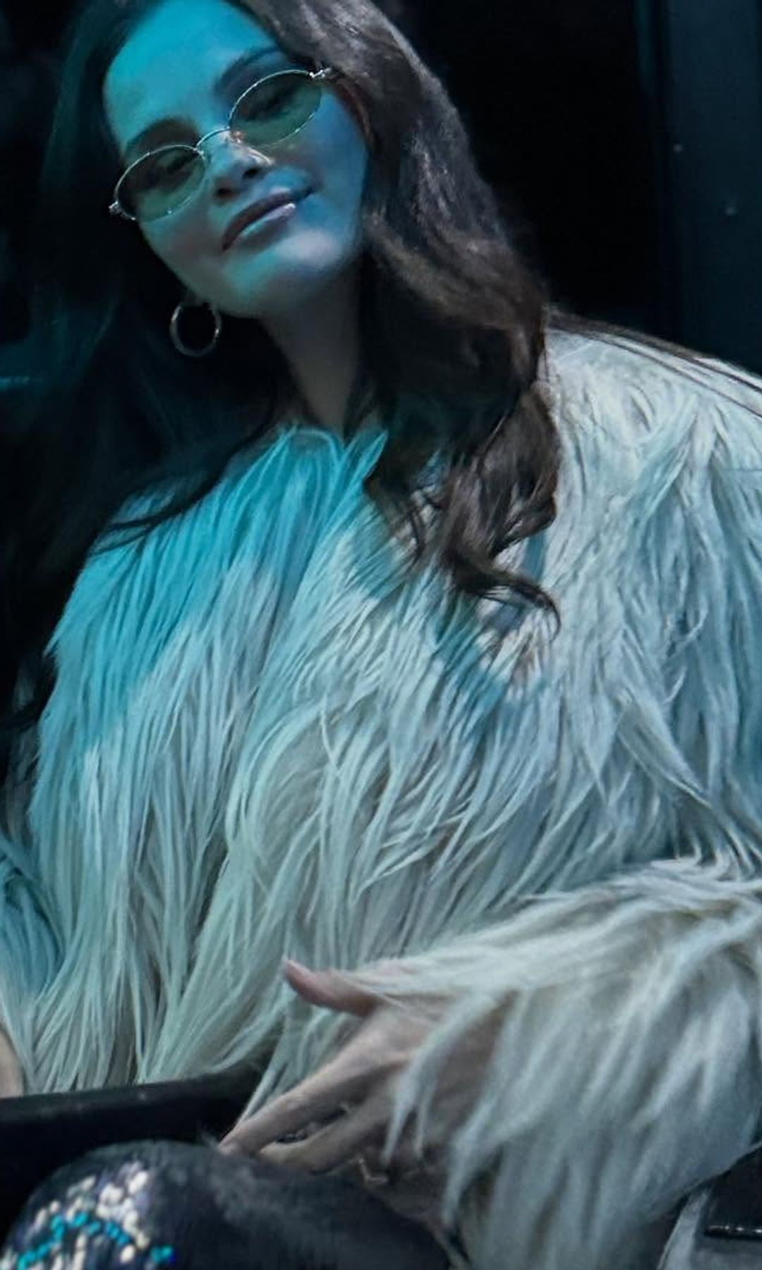 She paired her jumpsuit with a Celine coat