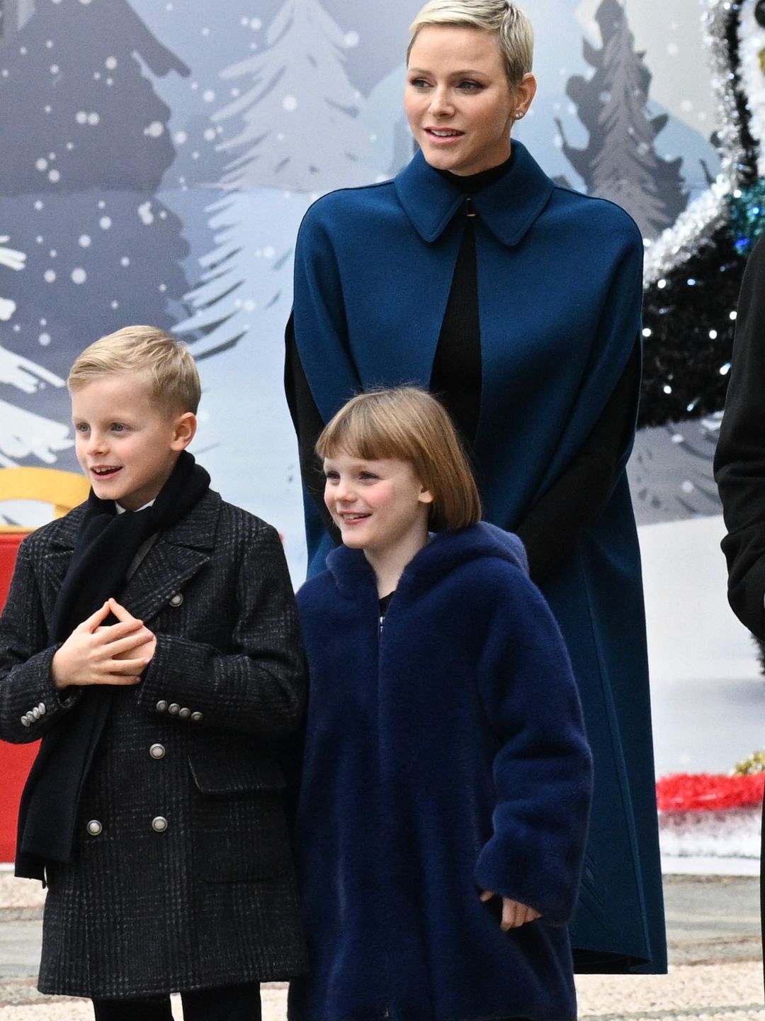 Princess Charlene and Princess Gabriella in blue coats