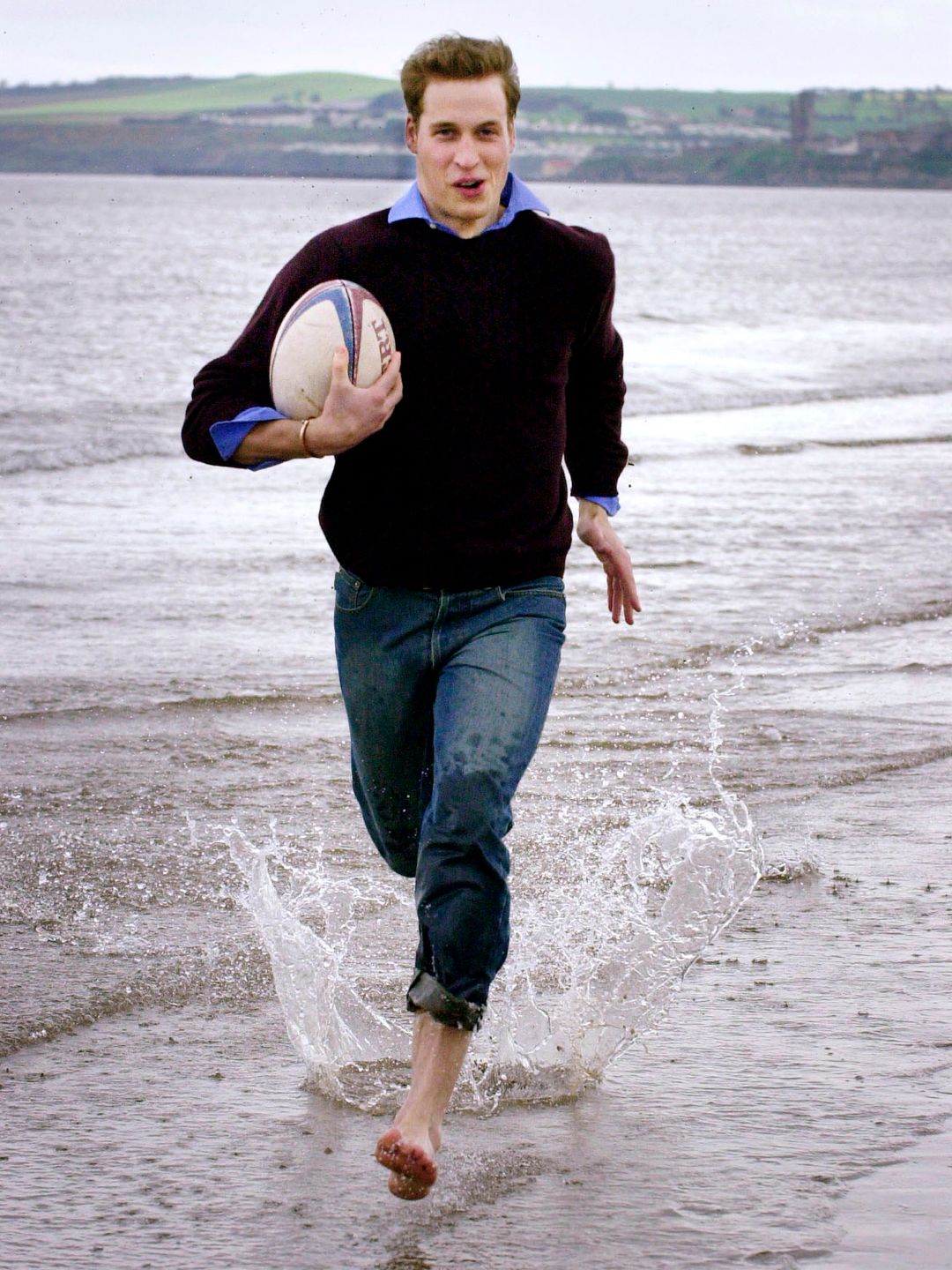 Prince William runs on the beach at university