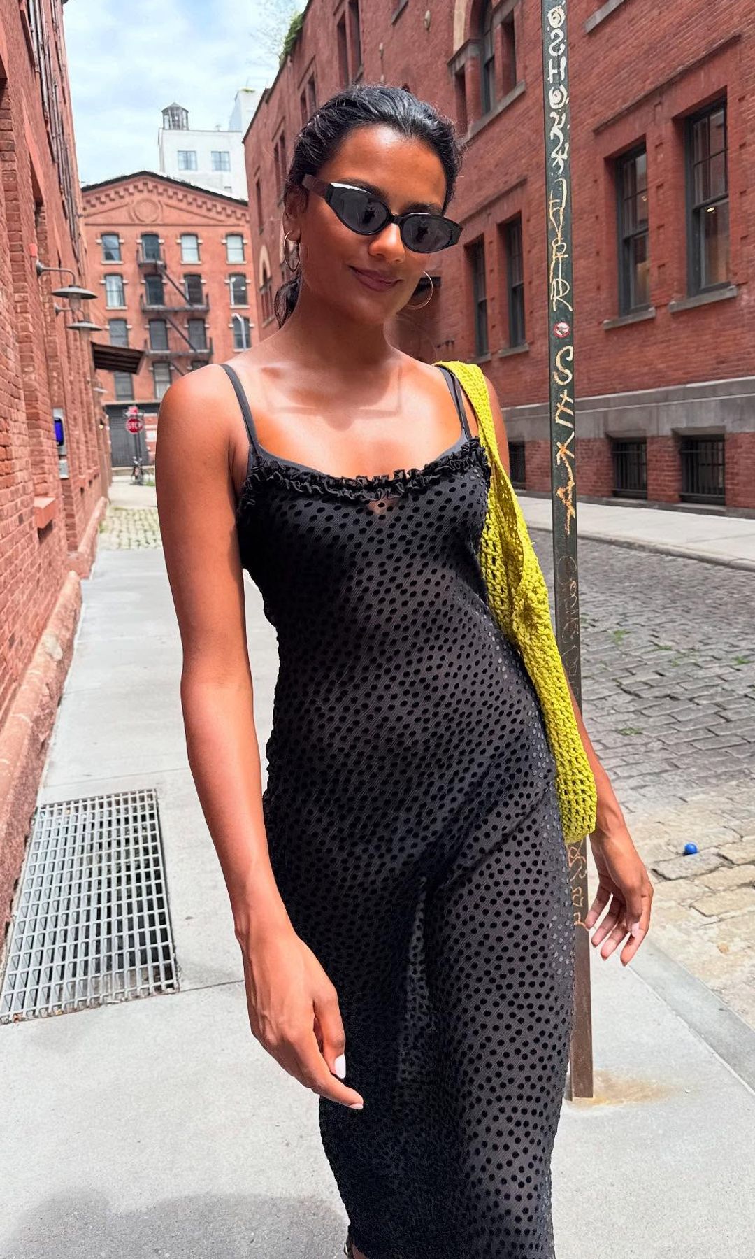 Simone Ashley wears a polka dot sheer dress 
